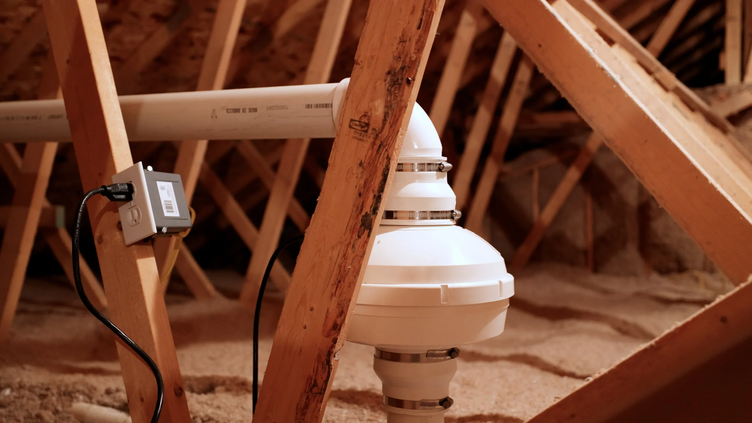 Radon fan and vent piping in an attic